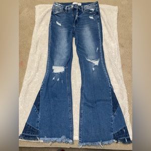 Medium wash. Distressed flare jeans